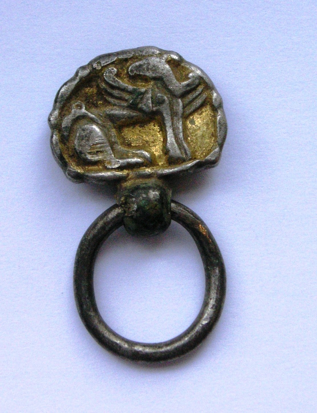silver gilded fitting with griffon
